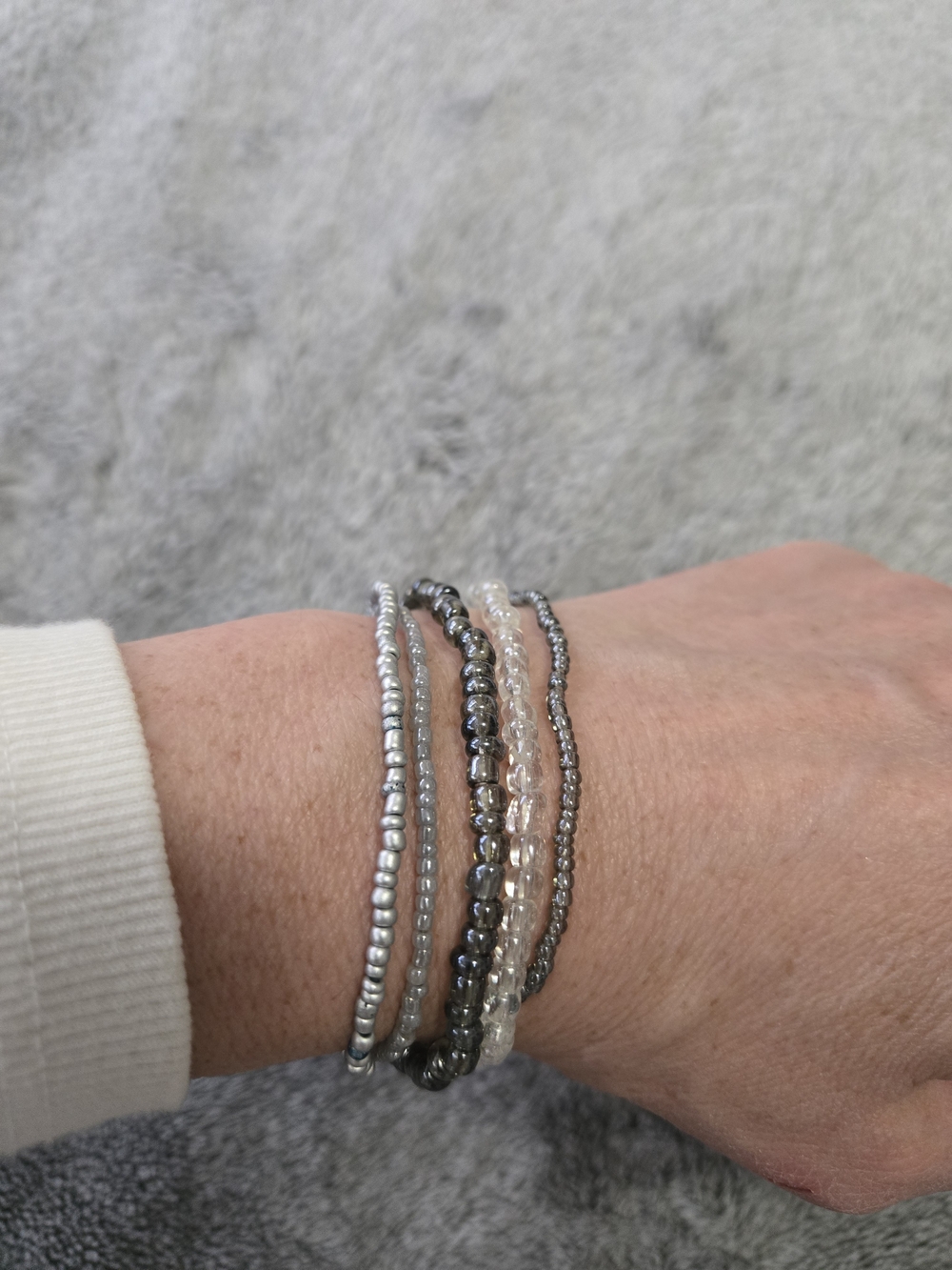 Stack of Silver, Clear and Gray Beaded Women's Bracelets